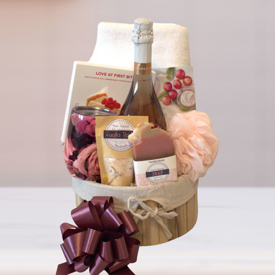 Rose spa  gift basket contains rose wine, face masks, chocolate bark, rose wine tumbler, face towel, vanilla roses soap and bath salts s
