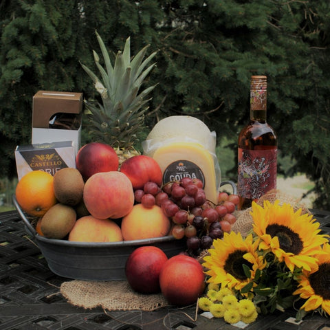 Fruit gift basket calgary gift basket fruit peaches grapes oranges pineapple kiwi rose wine sunflowers