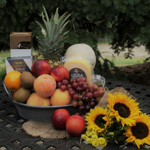 Fruit gift basket calgary gift basket fruit peaches grapes oranges pineapple kiwi sunflowers